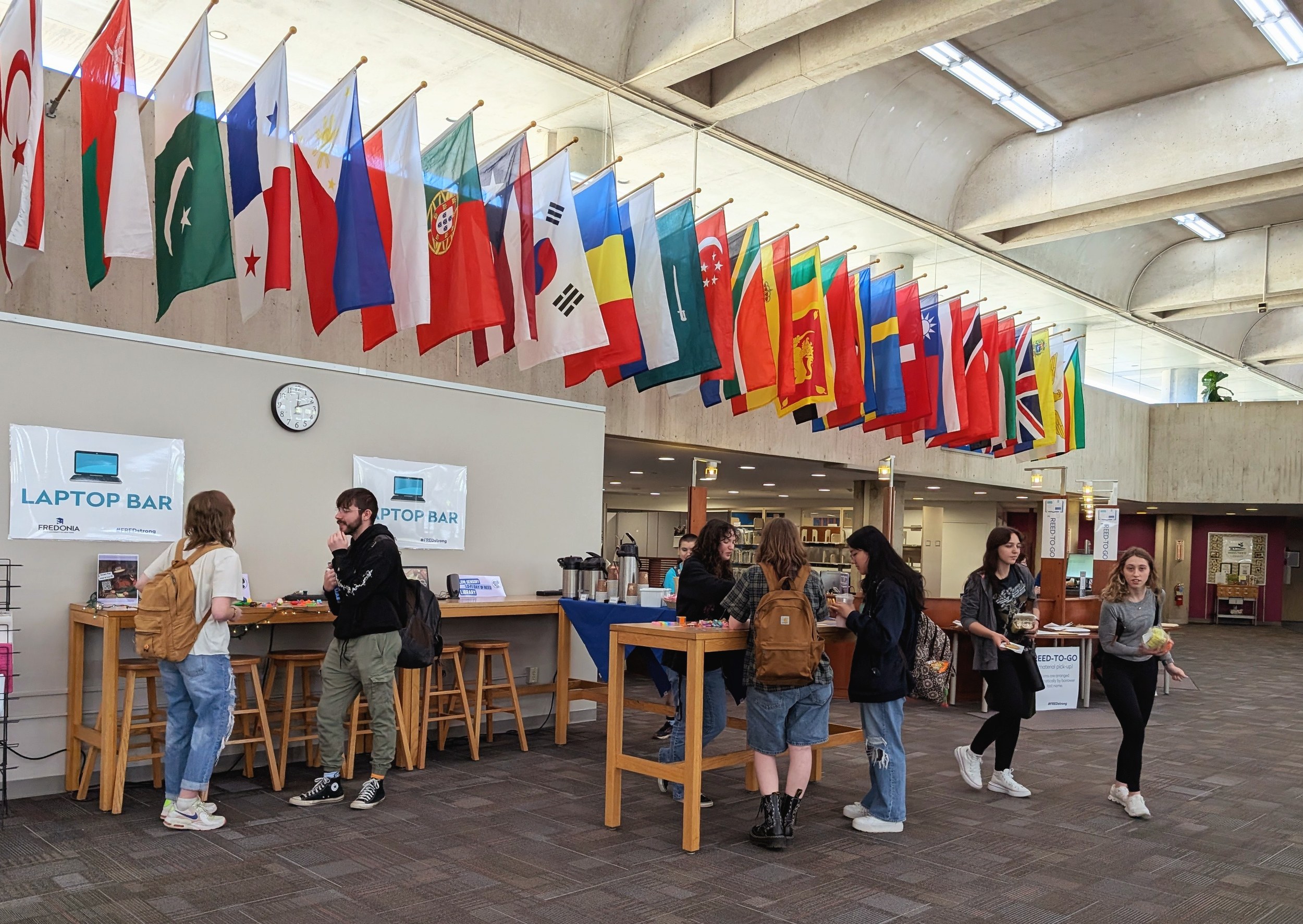 The Fuel Up laptop bar beneath international flags